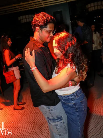 A close, connected moment between two dancers during a slow song. The emotion is palpable.