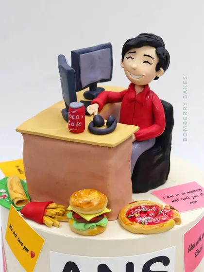 A close-up of the boss figurine at his desk, surrounded by tiny edible versions of pizza, burgers, and fries.