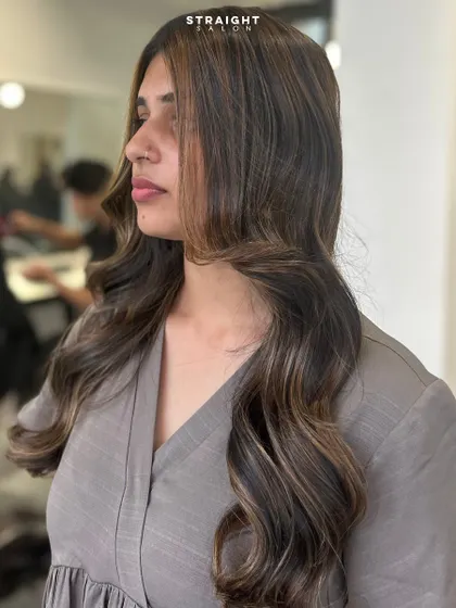 A side view of the client, showing how the subtle highlights frame her face and add dimension.