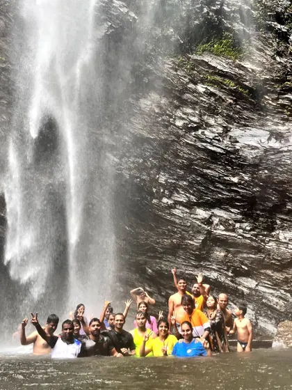 A happy, drenched group at the waterfall.
