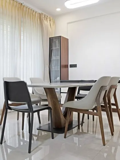 A wider view of the dining room, showing the full setup. The design is simple and modern, ideal for family dinners or weekend brunches. It’s a space that invites you to linger.