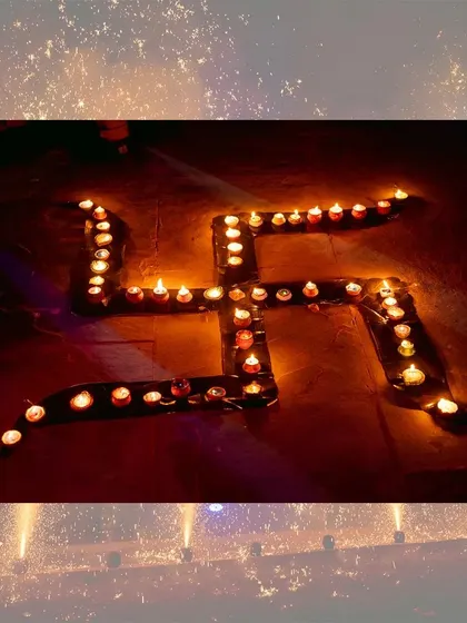 A beautiful arrangement of diyas forming a Swastika, a traditional symbol of good fortune during Diwali.