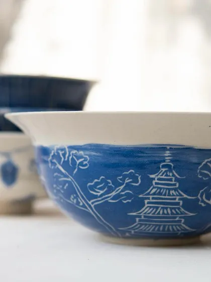 These tastefully made ramen bowls were created by our Foundation students. They are beautifully decorated with detailed sgraffito work inspired by Japanese patterns, landscapes, and culture, turning a functional item into a piece of art.