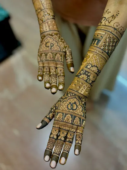 An angled perspective of the personalized engagement mehendi.