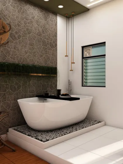 Another view of the luxurious bathroom, highlighting the freestanding tub on a bed of pebbles and the textured stone wall that adds a rustic, natural element.