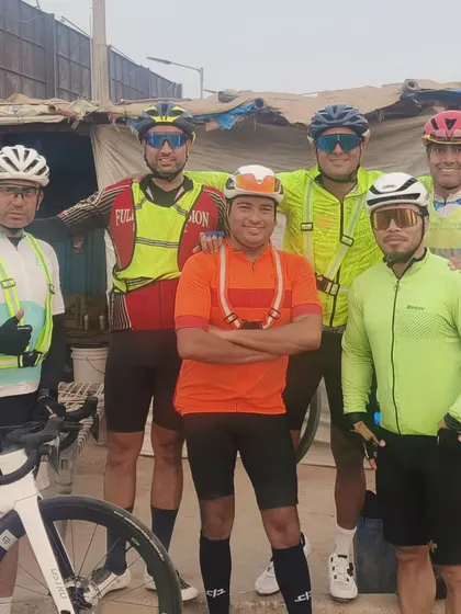 A group of six riders posing during a tough BRM. The smiles hide the immense effort and grit required to keep going.