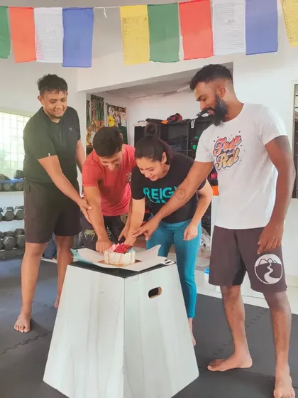 Cutting the cake for our 4th anniversary. We celebrate our milestones together as a team.