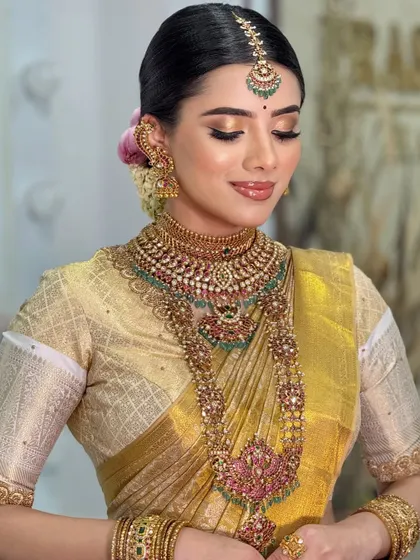 A serene, eyes-closed shot that focuses on the soft, blended eyeshadow and the flawless finish of the airbrush makeup.