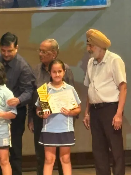 Heer Vohra on the stage receiving her award for 3rd place in the U-11 girls' category. Every tournament is a valuable learning experience, and I'm proud of her performance.