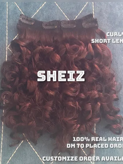 For those with short, curly hair, we offer custom short-length curly clip-on extensions to add volume and definition.