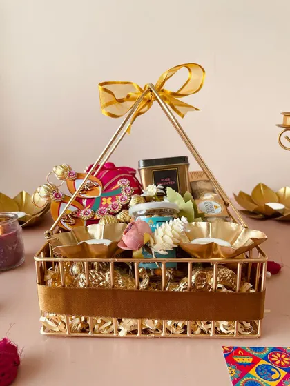 A side view of the luxe metal basket, highlighting the intricate design and the rich gold finish that makes it a standout gift.