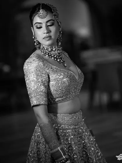 A graceful black and white portrait of the bride, her eyes closed, capturing a moment of serene beauty.