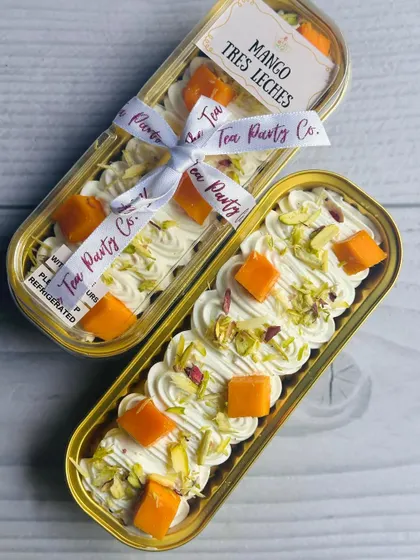 My Mango Tres Leches boats, packaged and tied with my signature ribbon, ready to be delivered.