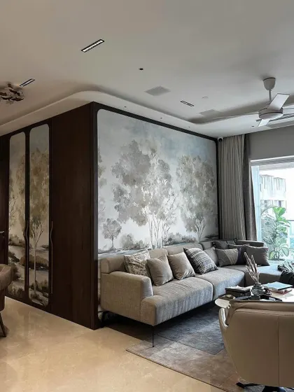 A beautiful living space by Arkamine Design, where our framed artisanal landscape wallpaper seamlessly unites the dining and living areas. The mural adds a sense of natural beauty and harmony to the sophisticated interior.
