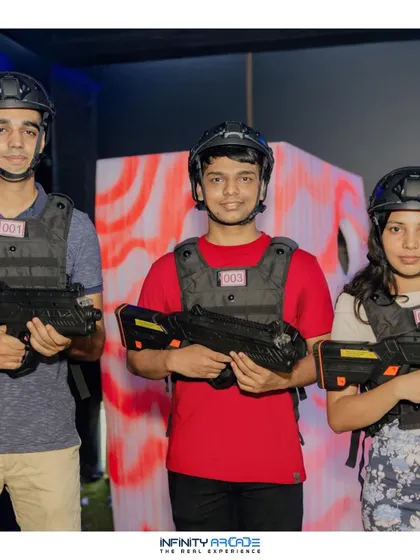 A team gets ready for their laser tag mission. Players are equipped with helmets and vests with glowing sensors, showing the professional-grade equipment I bring to every event.