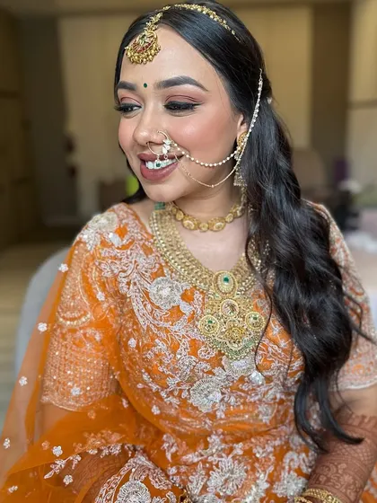 A lovely bride ready for her wedding. I styled her hair in a simple but elegant half-updo with soft waves, allowing her beautiful smile and traditional jewellery to be the main focus.