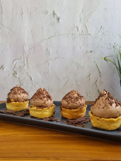 For a richer option, our chocolate tarts are a delight. A buttery crust is filled with silky chocolate mousse and topped with chocolate shavings.