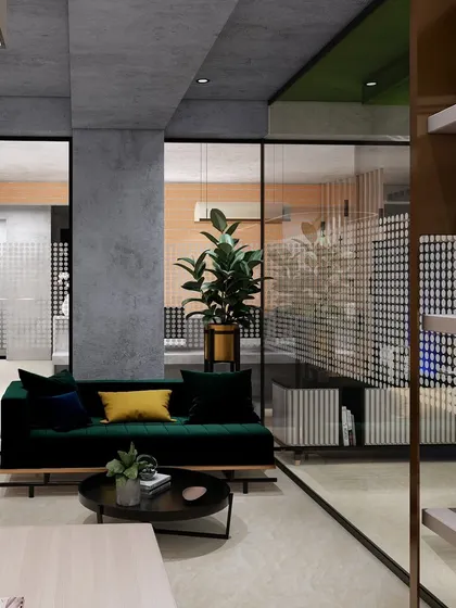 A view from the MD cabin into the main office area, showing how glass partitions maintain a connection while providing necessary privacy. The design is open and sophisticated.