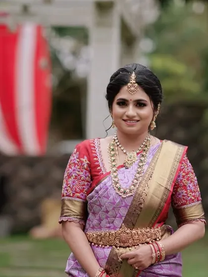 The bride looks absolutely stunning in her complete wedding attire, featuring my custom-designed blouse.
