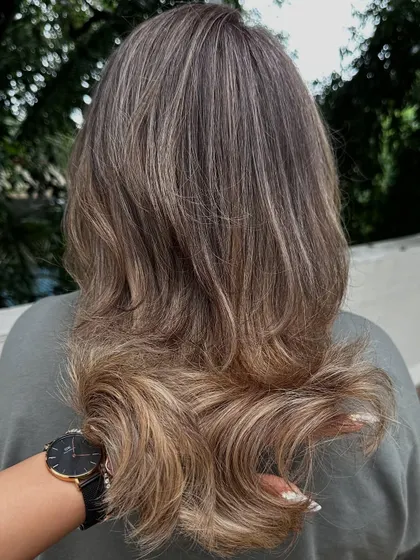 A shot from the back, showing the full effect of the "Vanilla Butter Cream" color and the layered cut.