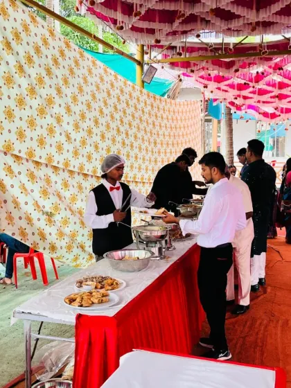 Our professional team is always ready to serve. Here is one of our staff members at the buffet counter during a wedding in Pen, making sure guests are served efficiently.