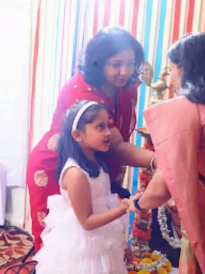 A child receives a lamp to light, a beautiful tradition to start our event.