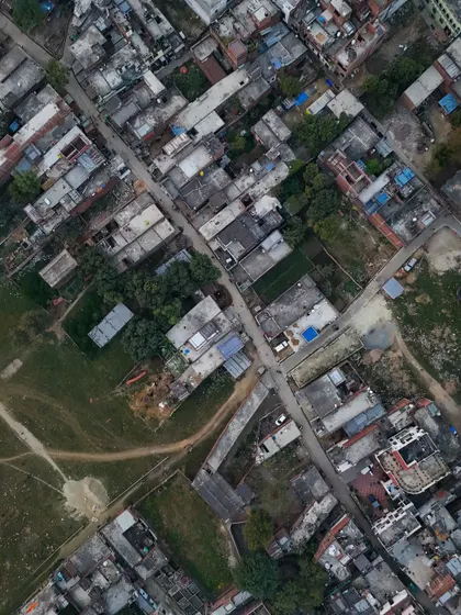 An overhead view of a village, showing the grid-like pattern of streets and houses. My drone helps me find stories in the geometry of a place.
