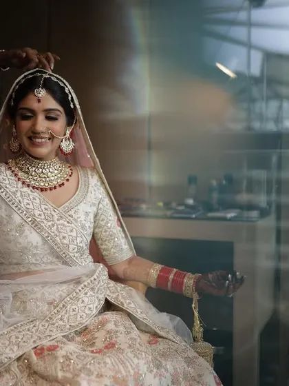 A behind the scenes moment, getting the final touches on her veil.