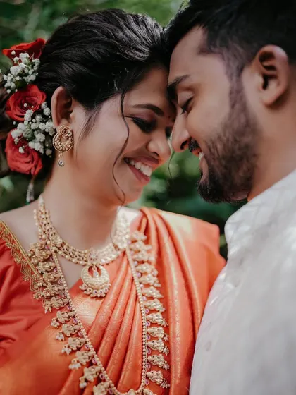 A close-up portrait filled with joy. The genuine smiles and connection between Ameya and Akshata make this shot truly special.