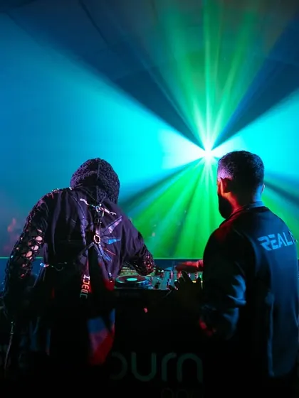 A powerful silhouette shot of me and Almost Human against the bright lights of the Sunburn festival stage.