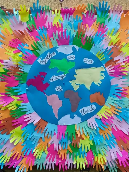 "Together we can change the world." This powerful art piece, made with the handprints of all our children, represents our commitment to teaching global citizenship and social responsibility.