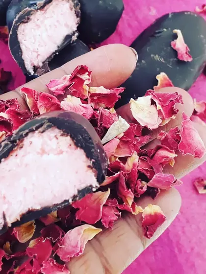 A close-up of my vegan rose-flavoured bounty bar. The creamy coconut filling and dark chocolate shell make for an irresistible combination, handcrafted with love.