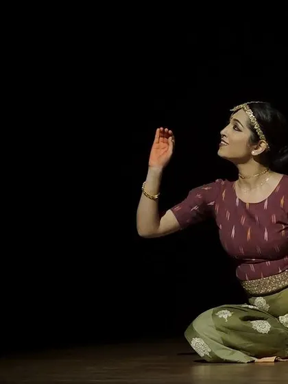 A solo moment of quiet contemplation from 'Rasadrishta'. The show balances high-energy group pieces with intimate, emotional solos.