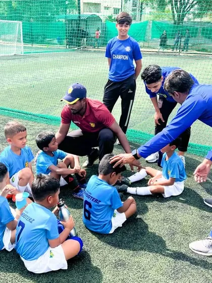 Our coaches giving a pep talk to the youngest players, building their confidence and love for the game.