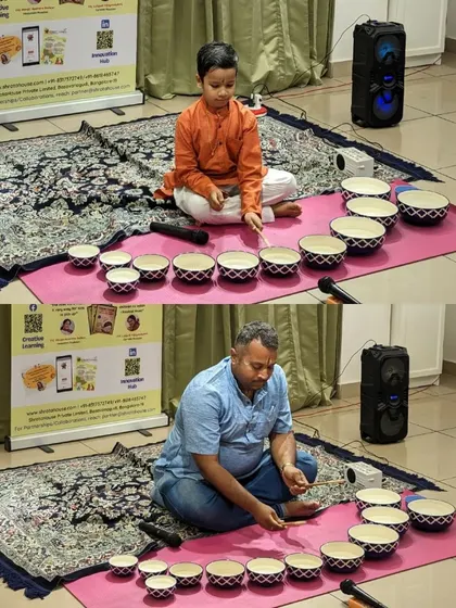 A father and son duo deeply focused on creating tunes with the Jaltarang. These sessions are as much for the parents' learning and enjoyment as they are for the children's.