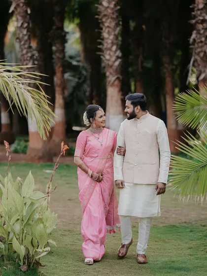 The couple taking a stroll in a park. This kind of walking shot helps create natural movement and candid interactions for the camera.