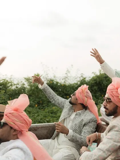 The groom's squad making a stylish entry in a vintage convertible for a Goa wedding. Baraat level: boss!