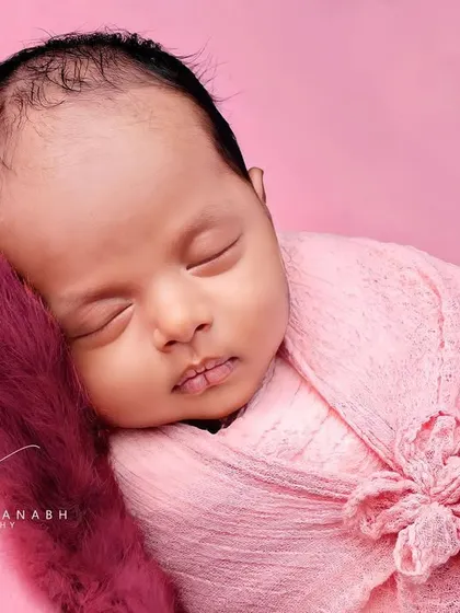 A detailed close-up of the baby's face, highlighting their perfect features.