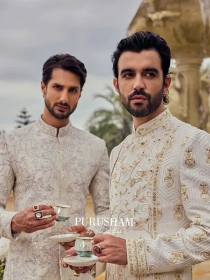 In a realm far from home, they stand as true symbols of heritage and modern royalty. The intricate gold and silver embroidery on their sherwanis is designed to complement each other perfectly.