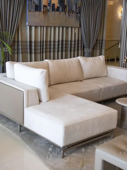 The Oslo Sofa is where simplicity meets contemporary style. We designed this L-shape sofa with a gentle aesthetic, featuring a back upholstered in muted taupe leatherette and a front in off-white fabric, creating a subtle and elegant contrast.