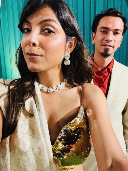 A selfie showing the details of my self-made saree look. The gold sequin blouse and simple diamond-look choker create a glamorous and modern ethnic style. I can help you put together similar looks.