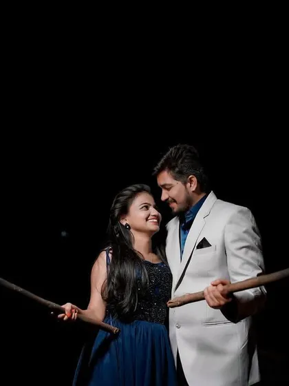 A powerful pose with the couple holding torches. This dramatic shot is for couples who want their pre-wedding photos to be bold and unforgettable.