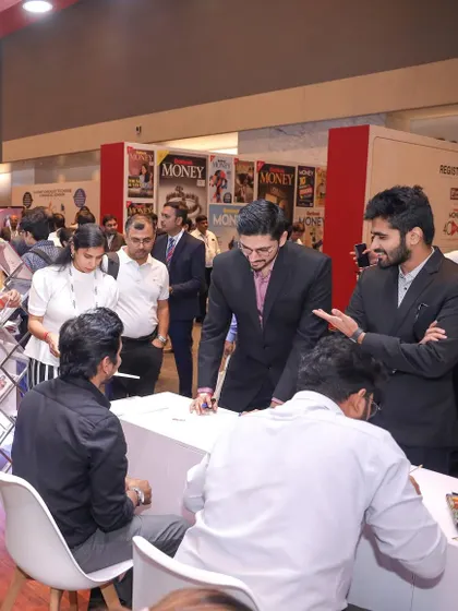 The atmosphere at the IDFC First Bank event was electric. Here you can see me interacting with attendees as I create their personalized storyline artworks.
