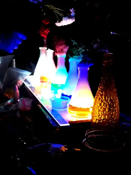 The 'Mad Scientist' table is set with glowing potions and beakers, creating an exciting and mysterious atmosphere for our workshop.