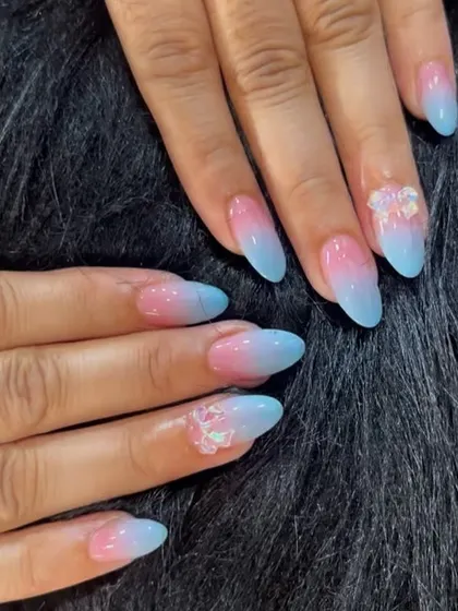 A soft and dreamy pink and blue ombre, like a cotton candy sky, with delicate 3D clear flower accents.