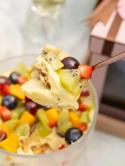 A spoonful of my summer Napoleon, which is an upgrade on the classic with the addition of fresh fruits like kiwi, grapes, and strawberries.