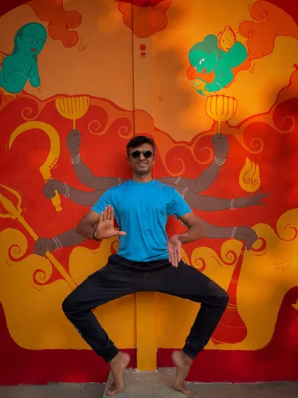 Me striking a pose in front of the beautiful mural at The Punyah Theatre. This space is a hub for our dance community, a place to learn, create, and perform.