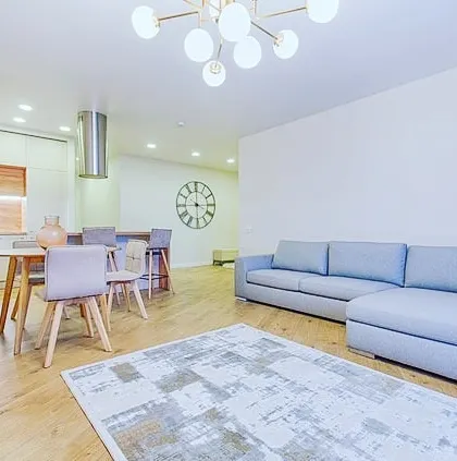 A minimalist open-concept living area where the quality of the white wall paint is key. I ensure a smooth, even application for a perfect, unobtrusive background.