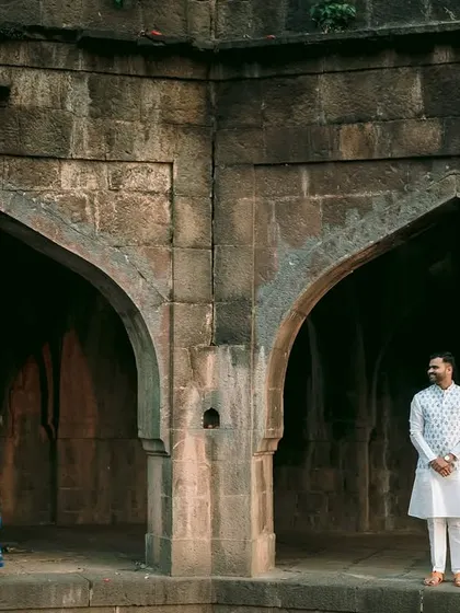 Using the architecture to create a sense of separation and connection simultaneously in this creative pre-wedding shot.