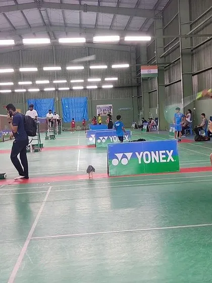A player executes a powerful jump smash during the YONEX SUNRISE Karnataka State Ranking Tournament held at our academy.